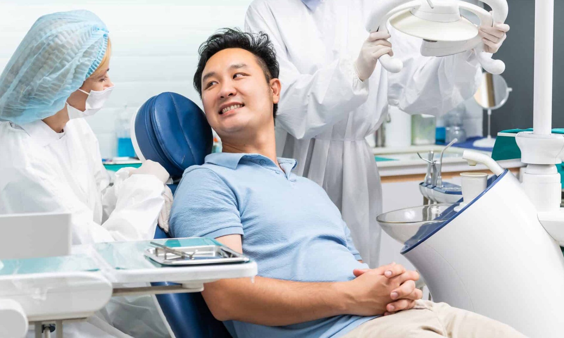 Caucasian,Dentist,Examine,Tooth,For,Young,Man,Patient,At,Dental